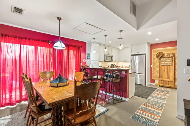 a view of a dining room with furniture