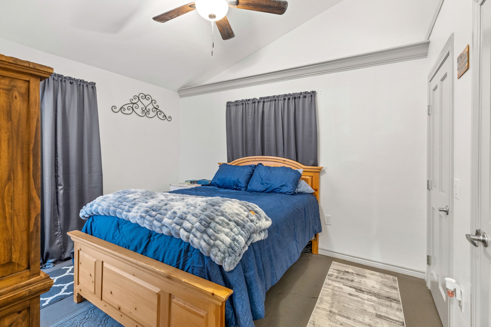 116 South Hackberry Avenue Luling, TX 78648 - Photo 35 of 39 a bed sitting in a bedroom next to a window