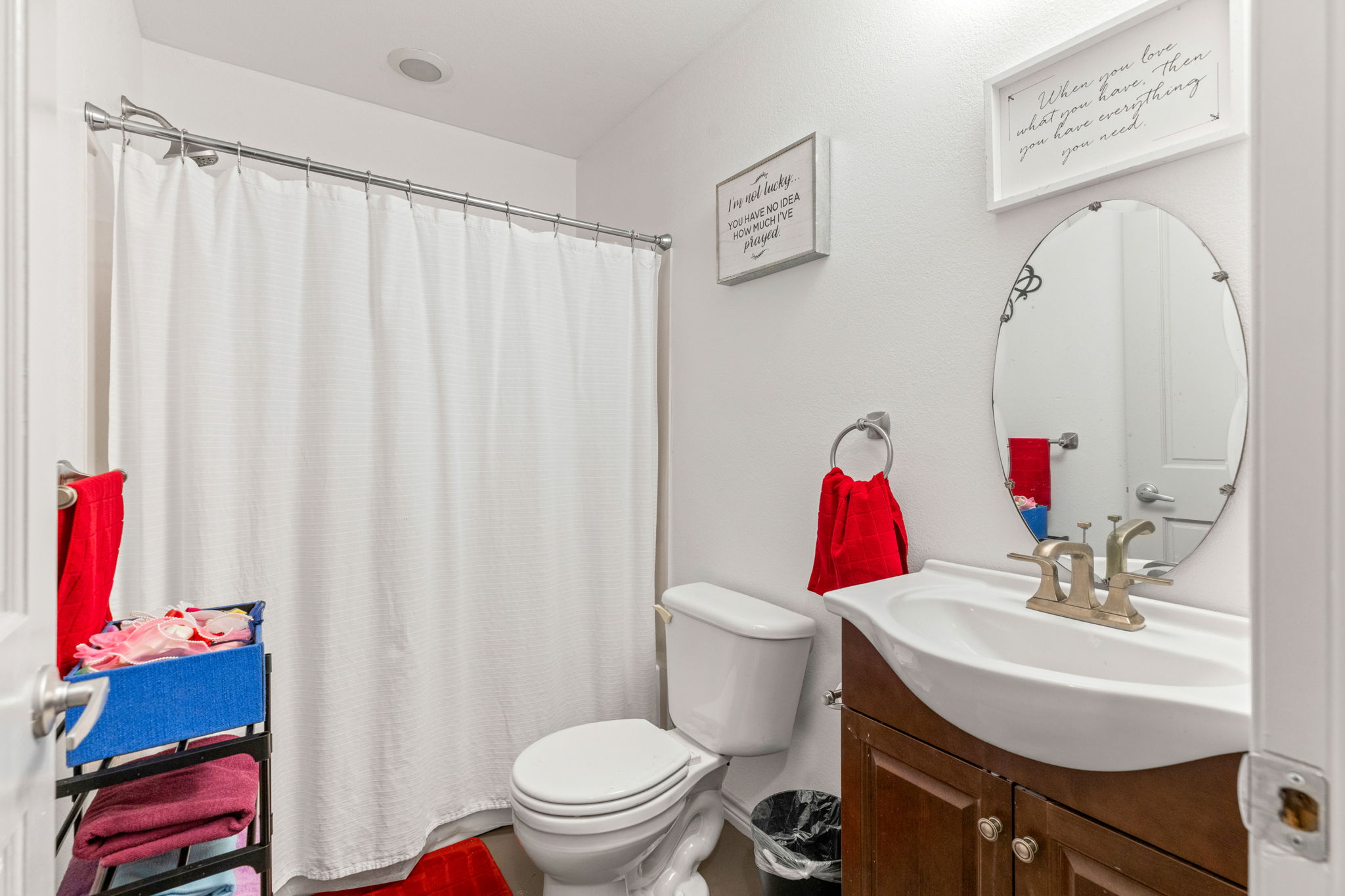 116 South Hackberry Avenue Luling, TX 78648 - Photo 39 of 39 a bathroom with a sink toilet and mirror