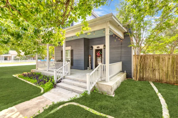 a front view of a house with garden