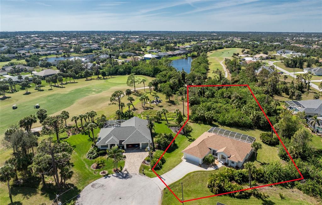 48 Par View Court Rotonda West, FL 33947 - Photo 1 of 1 an aerial view of residential houses with outdoor space