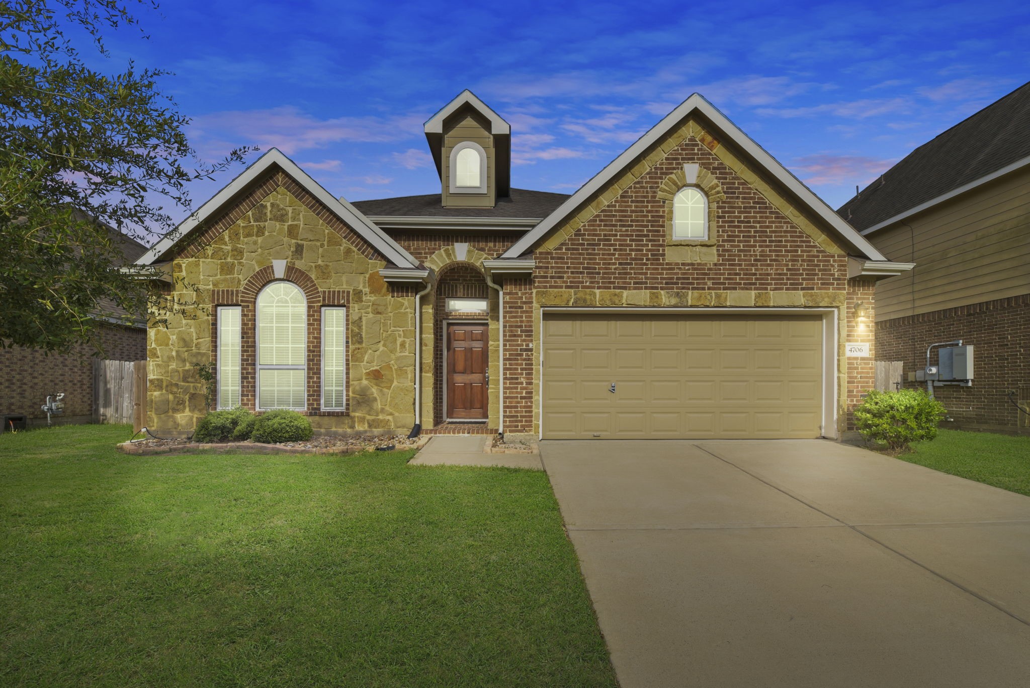 4706 Alluvial Circle Alvin, TX 77511 - Photo 1 of 39 a front view of a house with a yard and garage