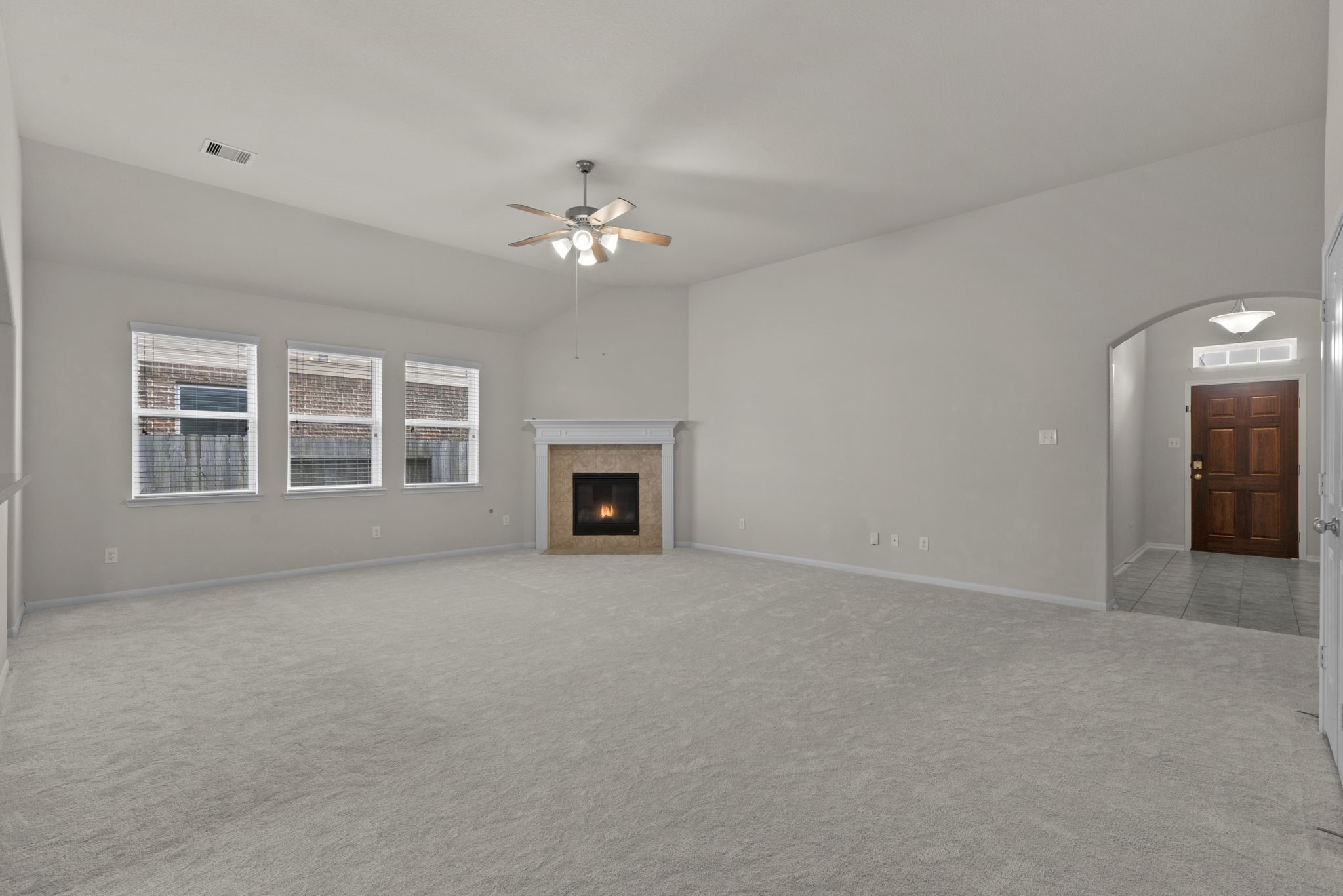 4706 Alluvial Circle Alvin, TX 77511 - Photo 16 of 39 a view of empty room with a fireplace