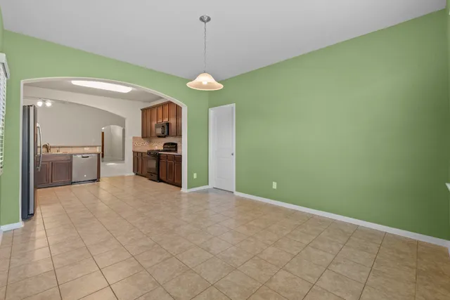 a view of a kitchen with a sink and a kitchen counter top space