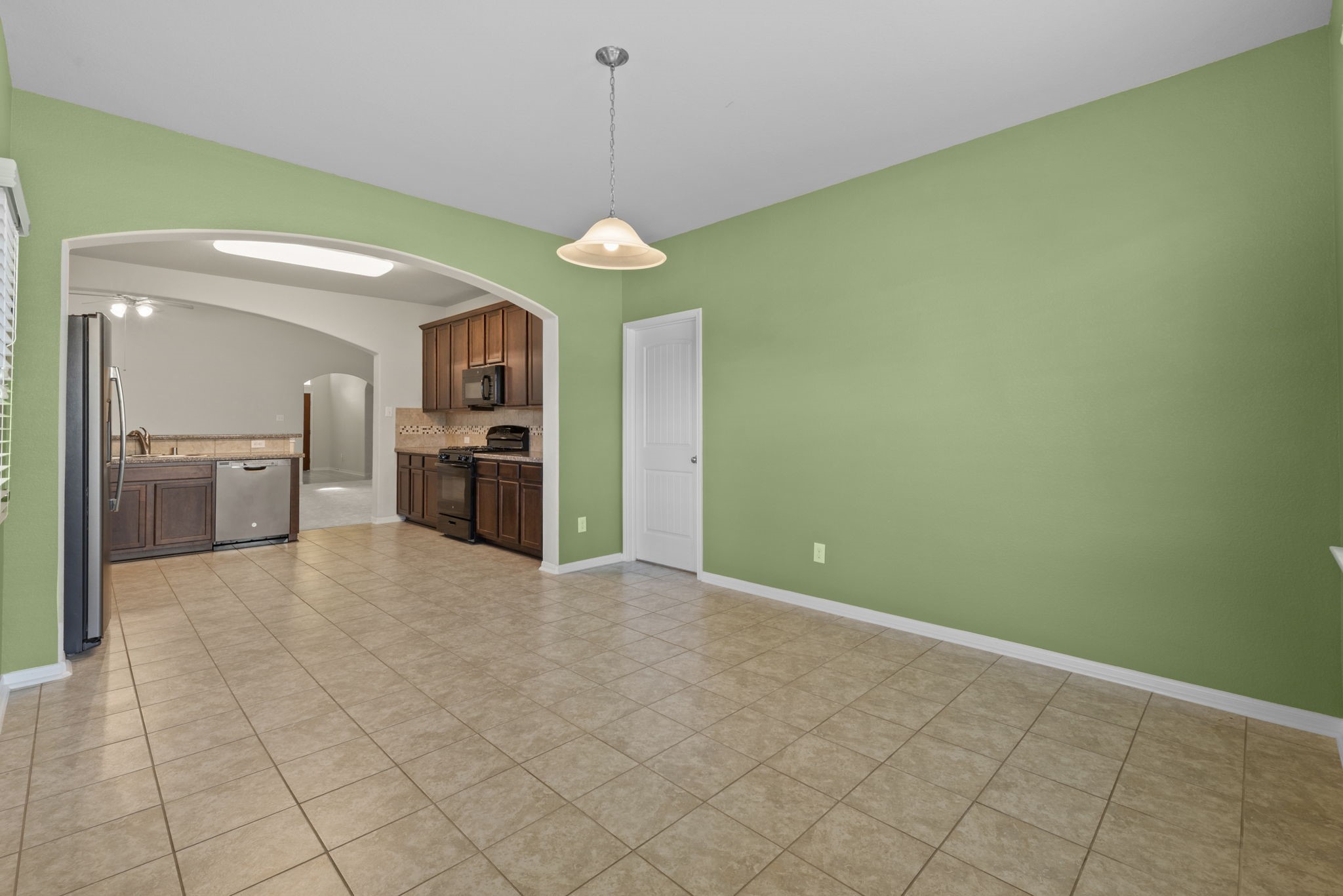 4706 Alluvial Circle Alvin, TX 77511 - Photo 21 of 39 a view of a kitchen with a sink and a kitchen counter top space
