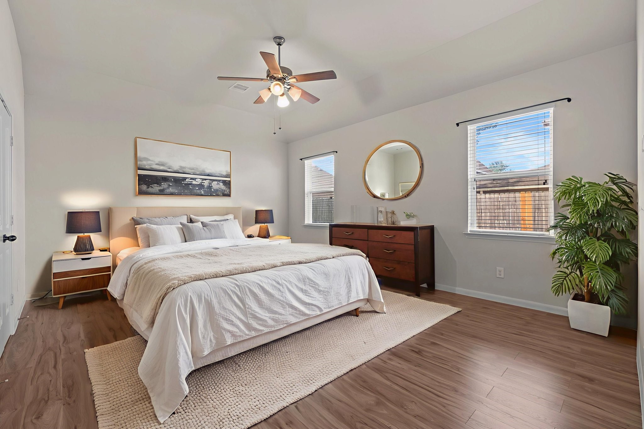 4706 Alluvial Circle Alvin, TX 77511 - Photo 22 of 39 a bedroom with a bed and a chandelier