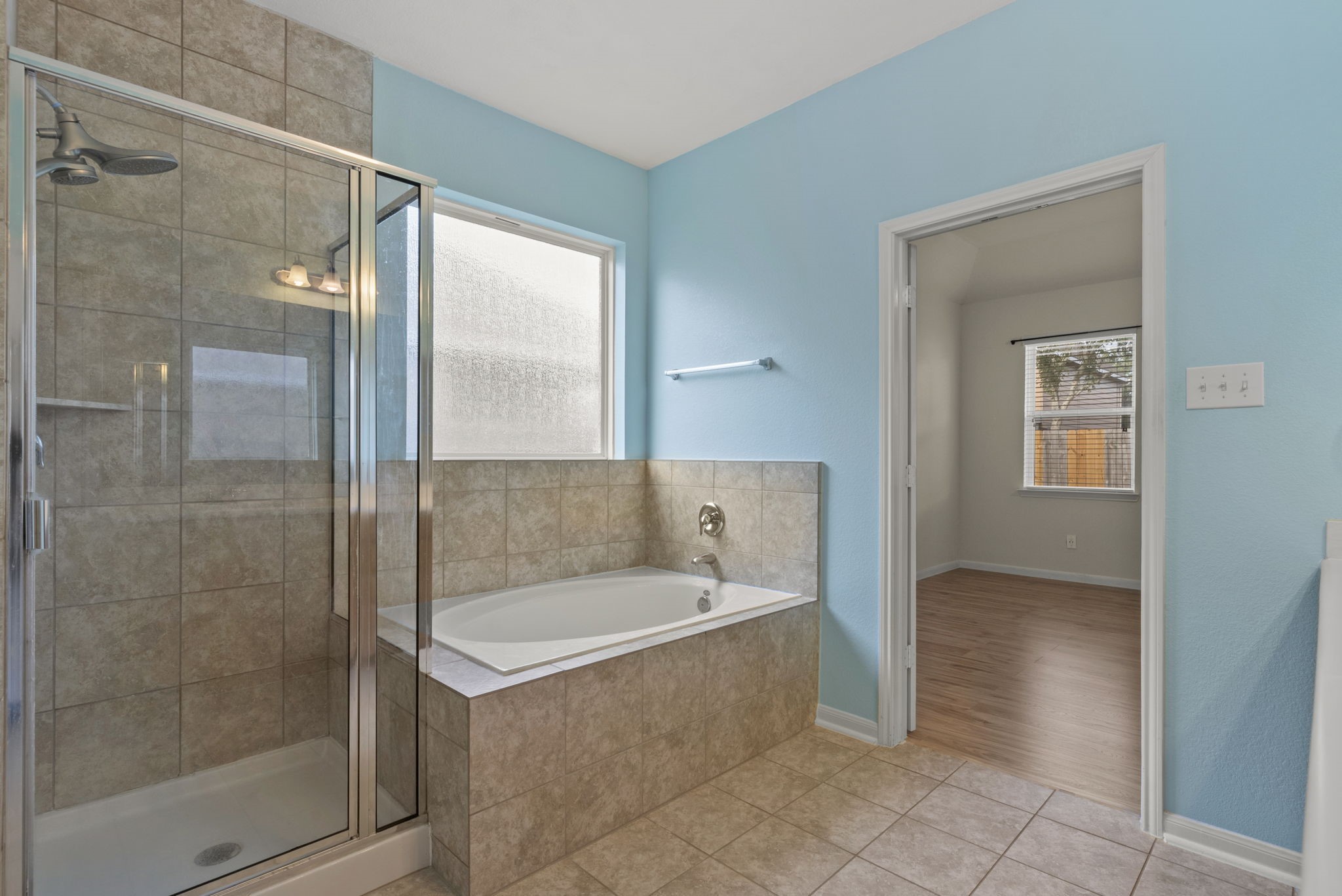 4706 Alluvial Circle Alvin, TX 77511 - Photo 26 of 39 a bathroom with a bathtub and a shower