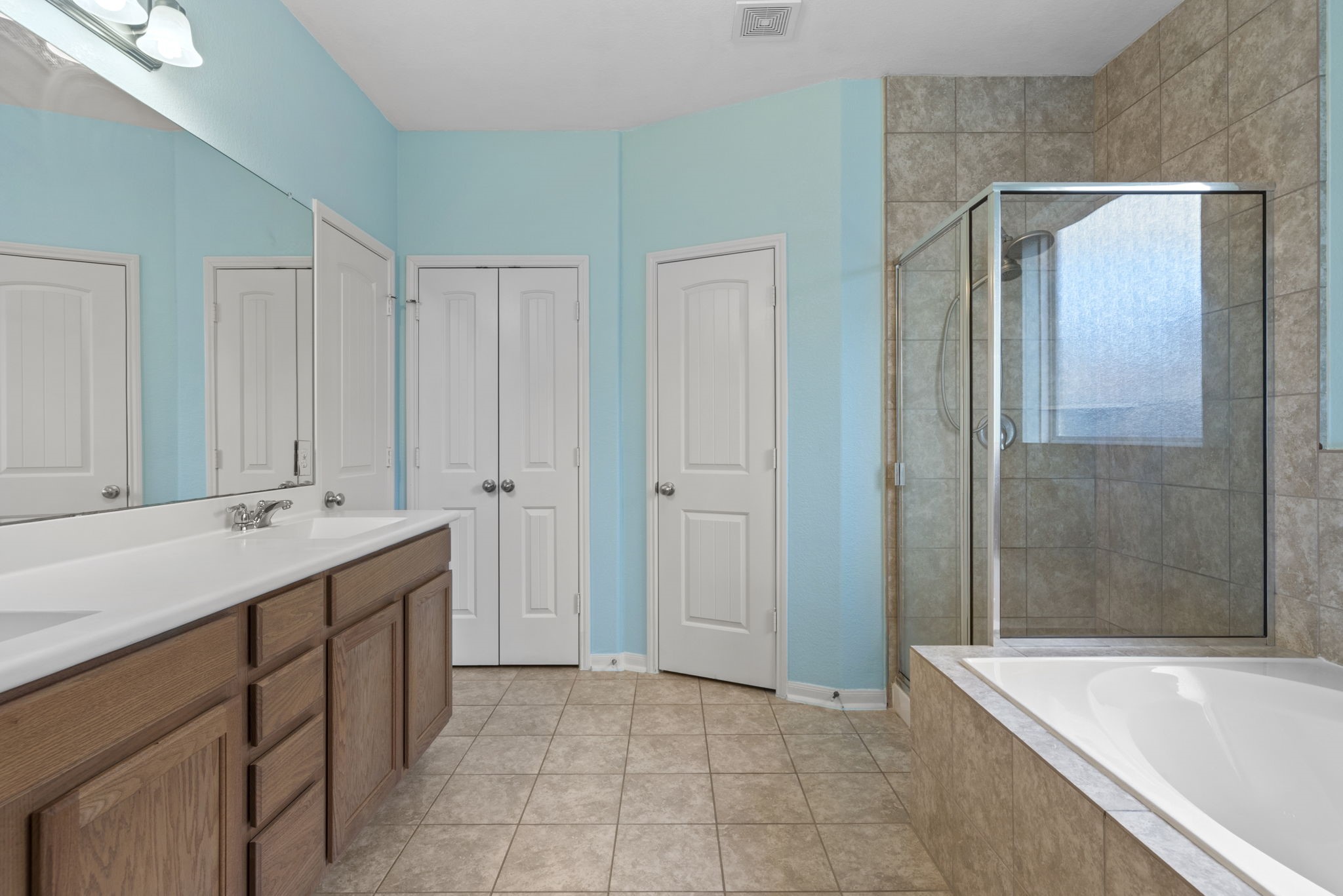 4706 Alluvial Circle Alvin, TX 77511 - Photo 27 of 39 a bathroom with a tub sink and mirror