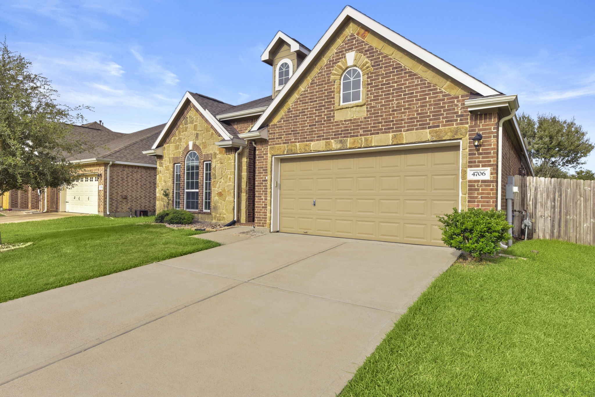 4706 Alluvial Circle Alvin, TX 77511 - Photo 3 of 39 a front view of a house with a yard and garage