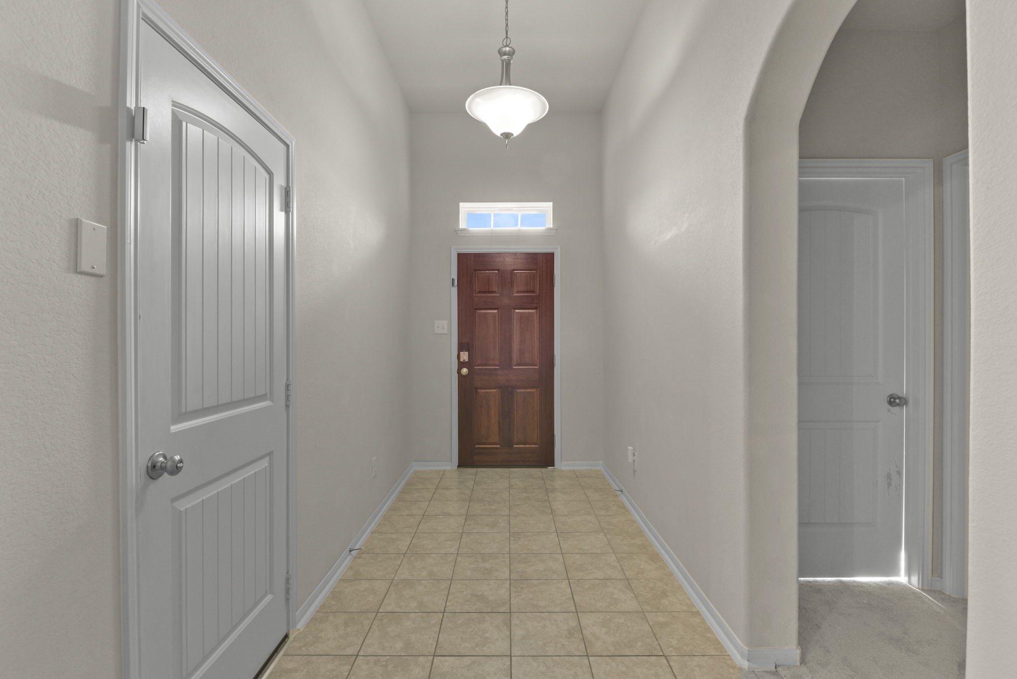4706 Alluvial Circle Alvin, TX 77511 - Photo 5 of 39 a view of a hallway with wooden shelves