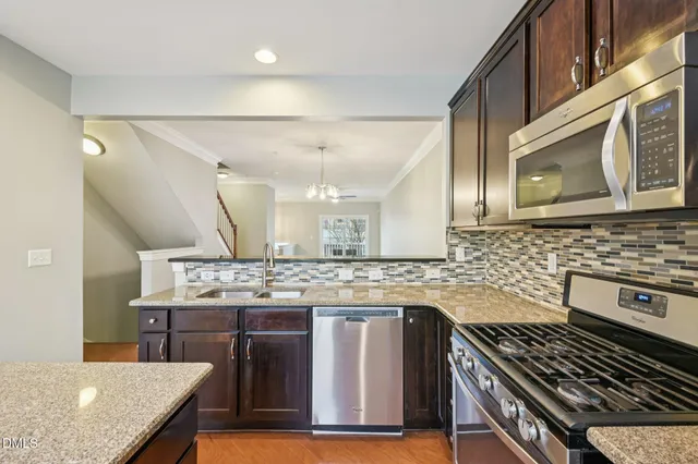 a kitchen with a stove and a sink