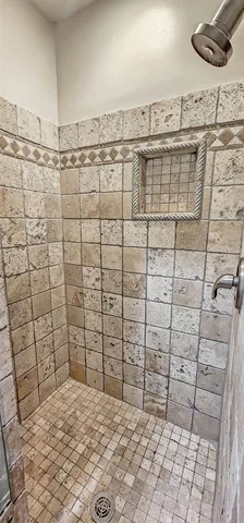 a view of a room with wooden floor and window