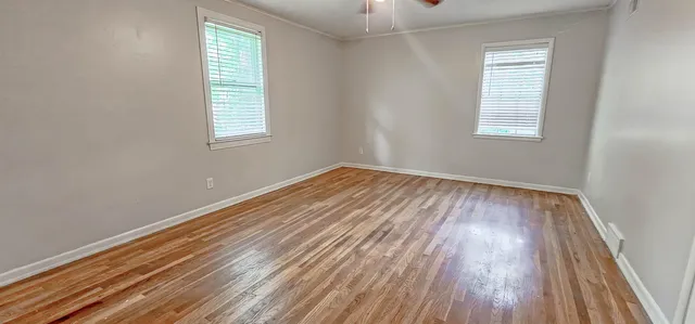 a bathroom with a sink toilet and window