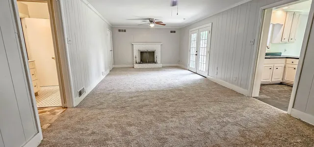 a view of empty room with windows