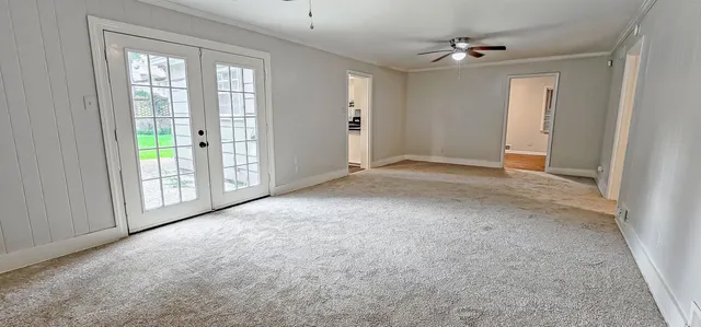 a kitchen with stainless steel appliances granite countertop a stove a sink and a refrigerator with wooden cabinets