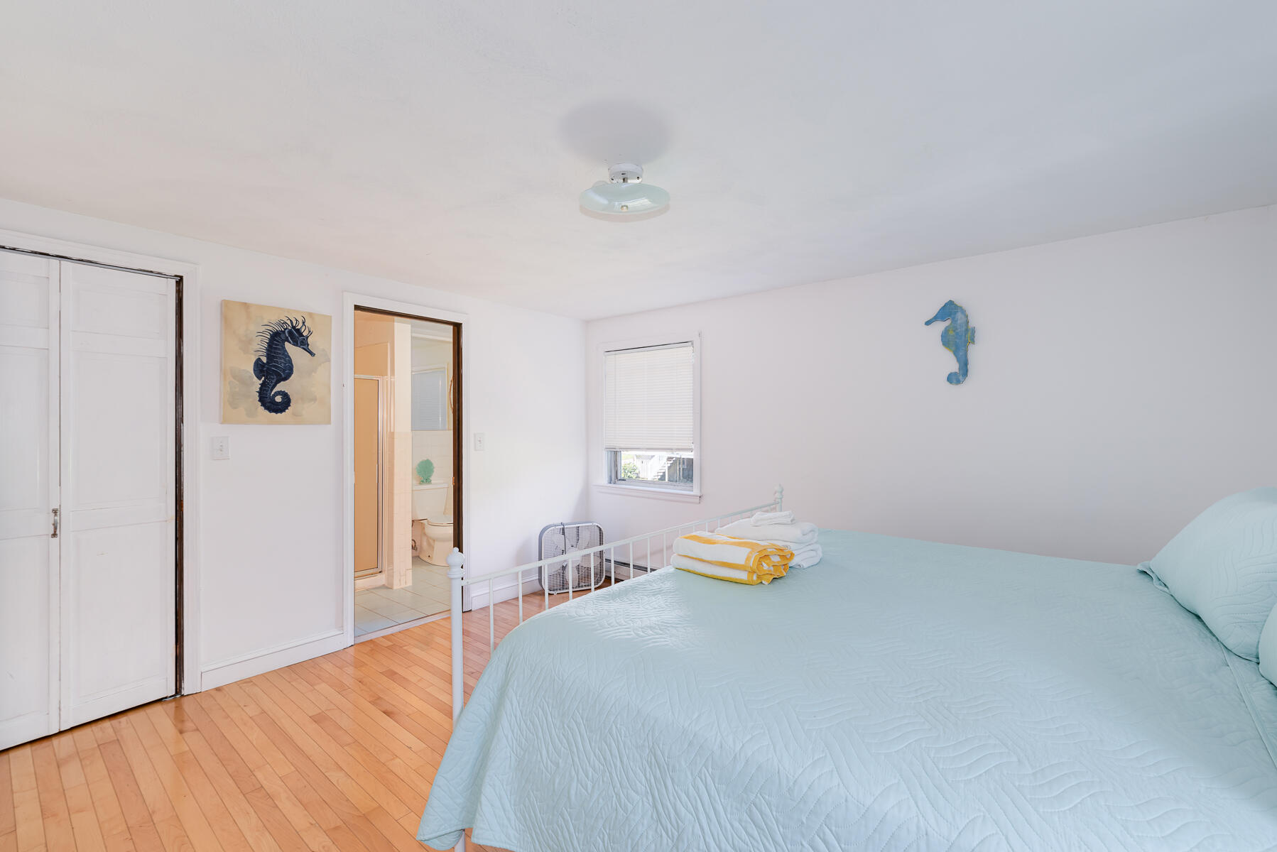 90 Ripple Cove Road Hyannis, MA 02601 - Photo 14 of 38 a bedroom with a bed and wooden floor