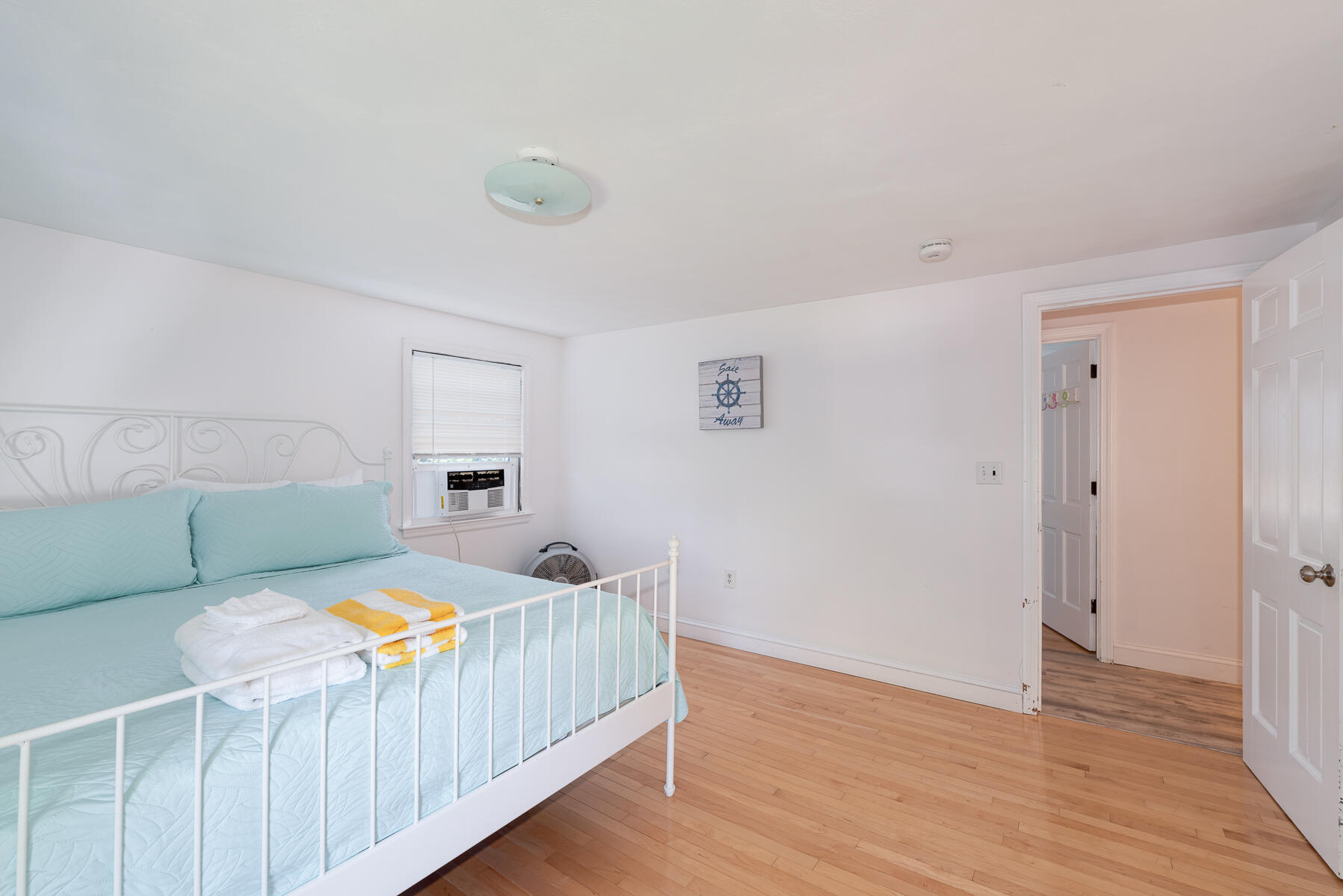 90 Ripple Cove Road Hyannis, MA 02601 - Photo 16 of 38 a bedroom with a bed and a table