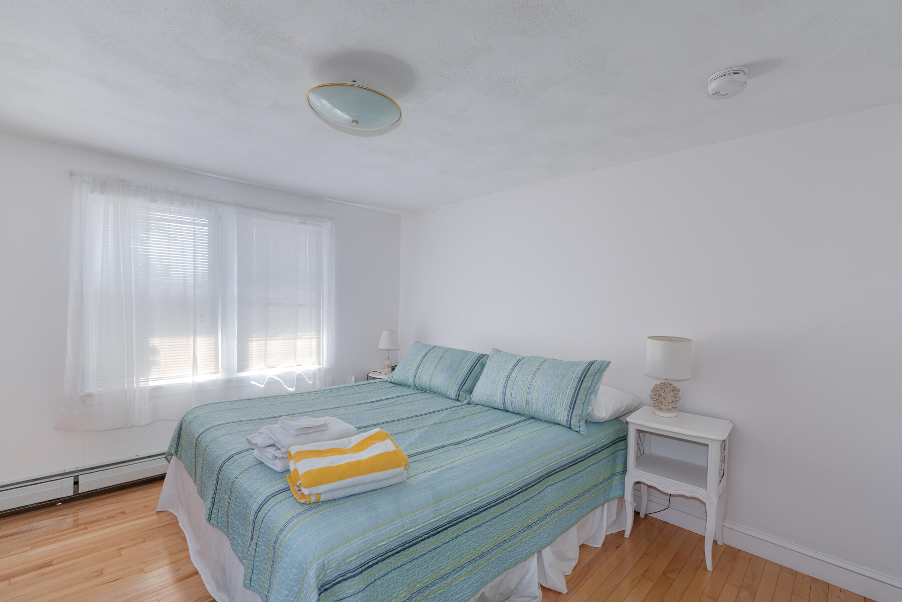 90 Ripple Cove Road Hyannis, MA 02601 - Photo 17 of 38 a bedroom with a bed and a window
