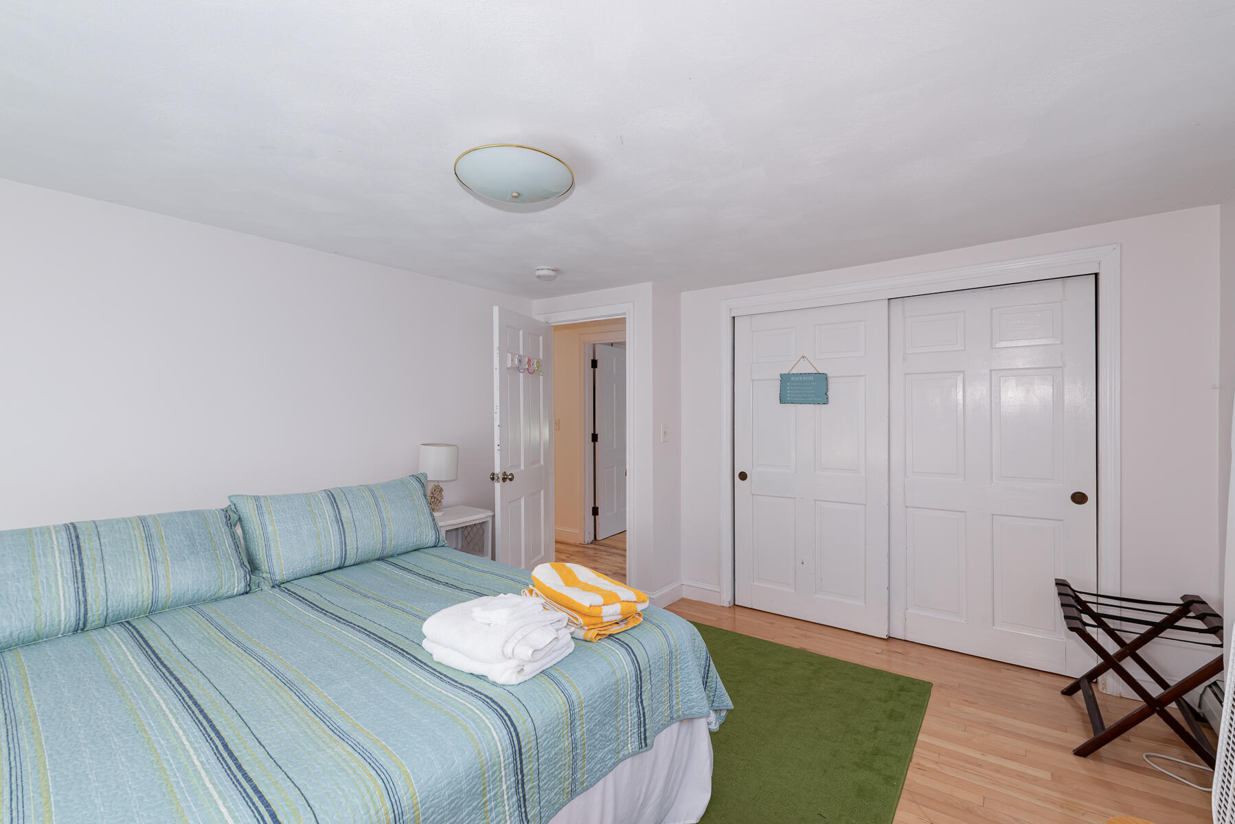 90 Ripple Cove Road Hyannis, MA 02601 - Photo 18 of 38 a bedroom with a bed and wooden floor