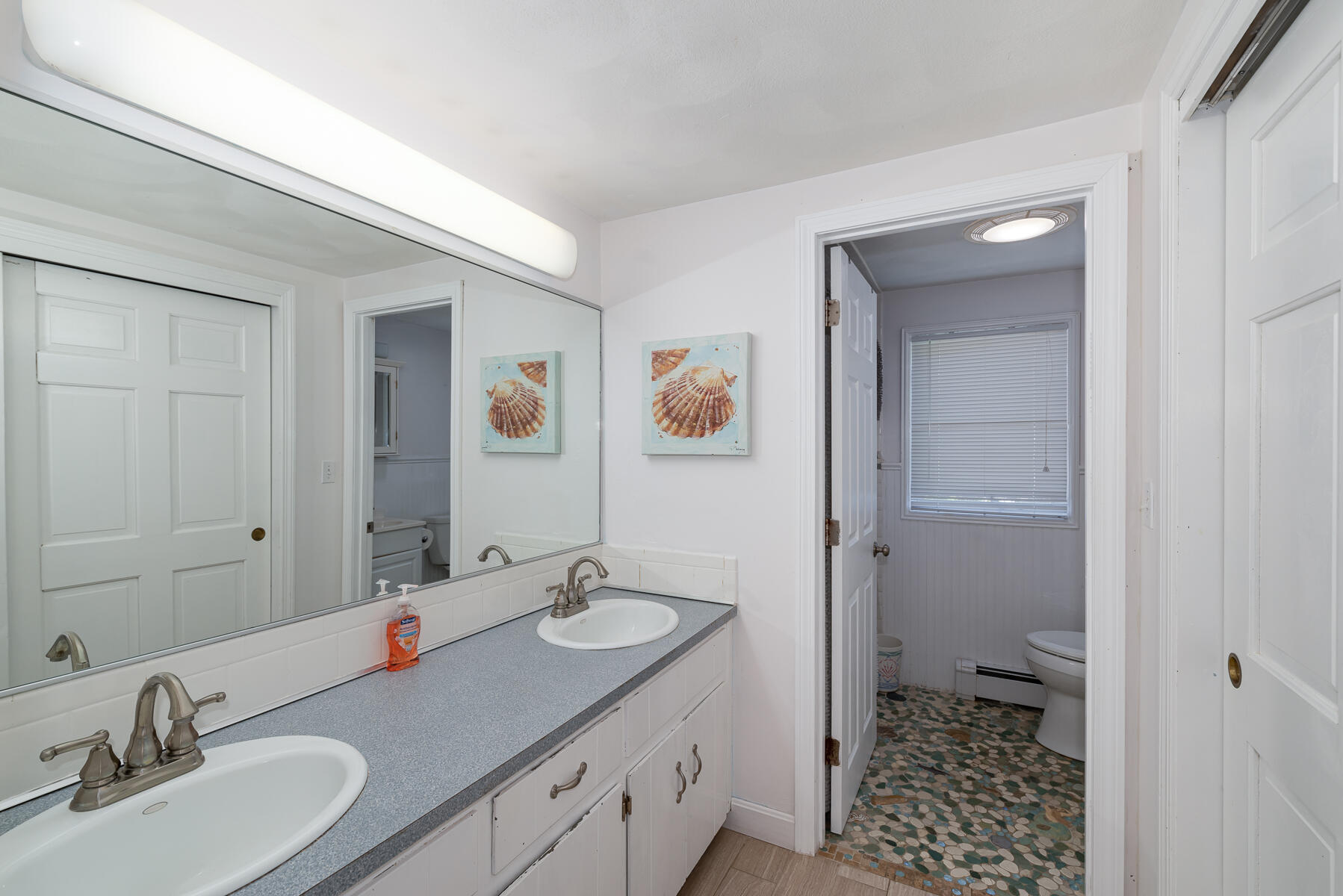 90 Ripple Cove Road Hyannis, MA 02601 - Photo 19 of 38 a bathroom with a sink a toilet and shower