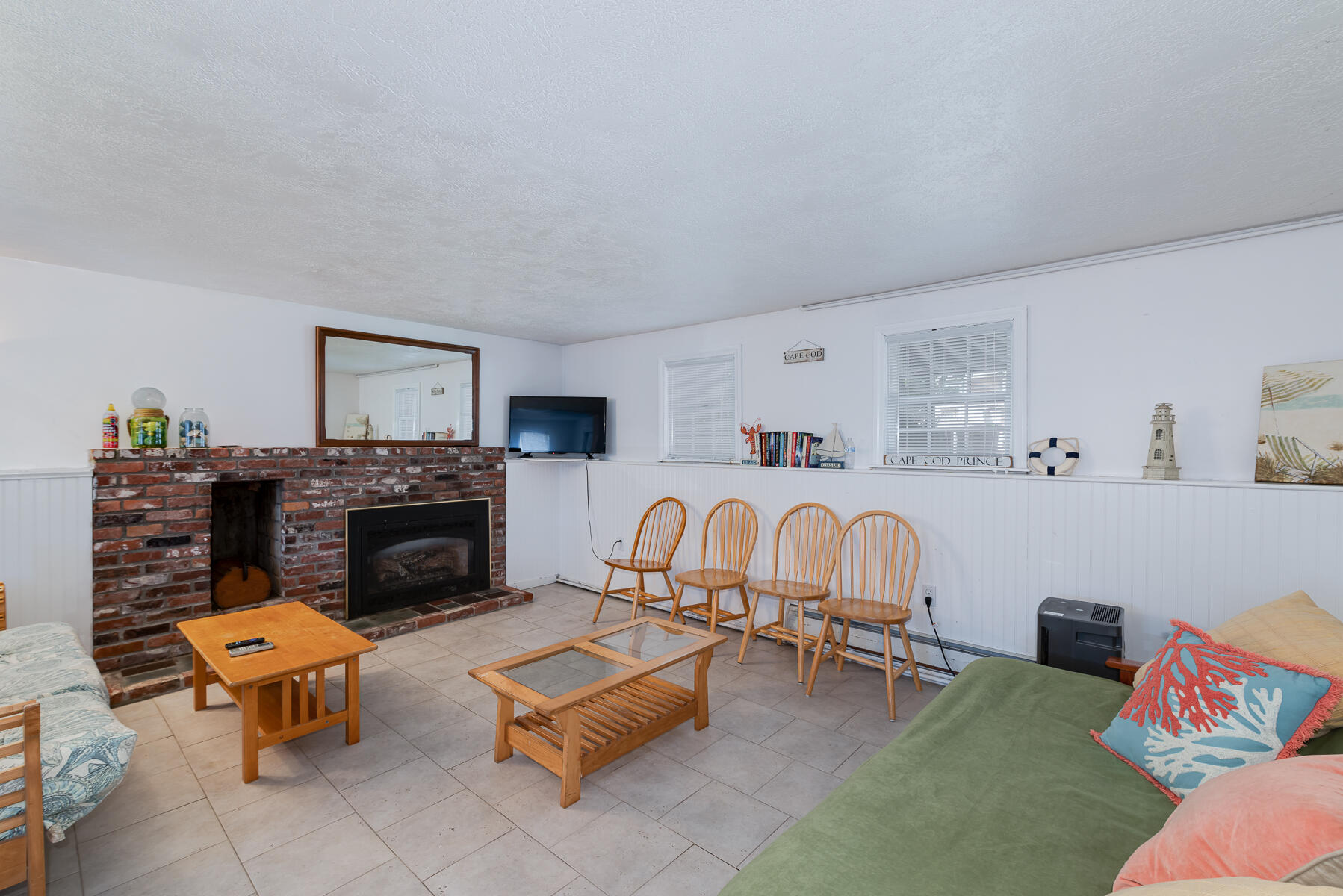 90 Ripple Cove Road Hyannis, MA 02601 - Photo 25 of 38 a living room with furniture and a fireplace