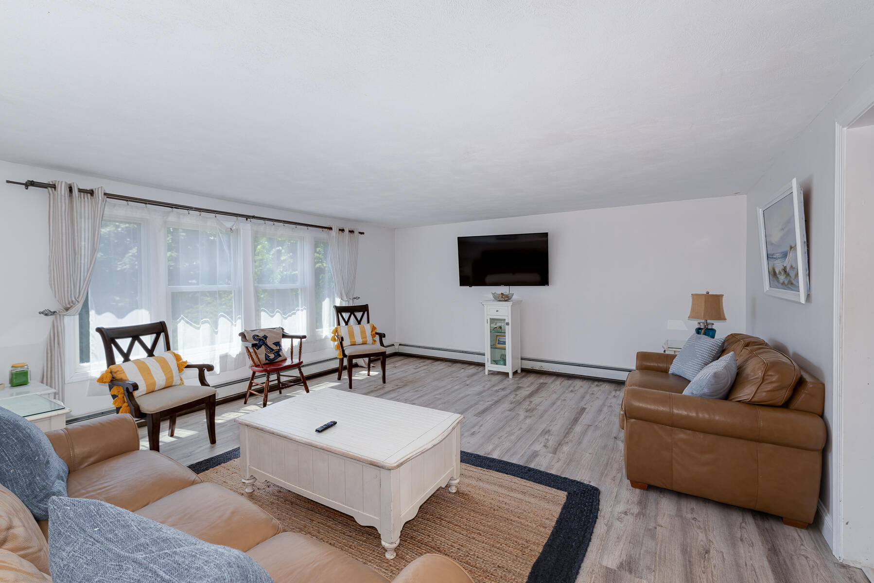 90 Ripple Cove Road Hyannis, MA 02601 - Photo 6 of 38 a living room with furniture and a flat screen tv