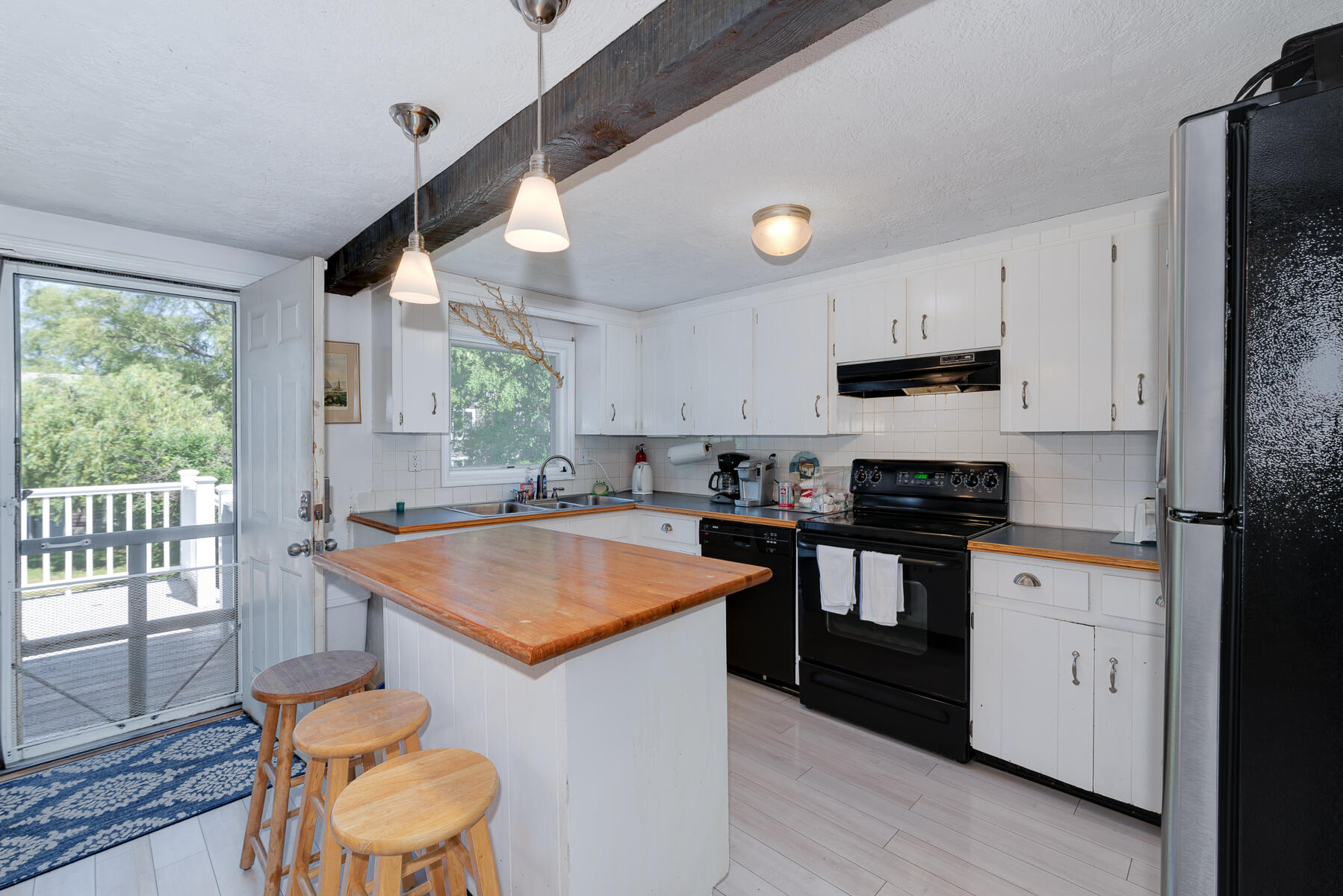 90 Ripple Cove Road Hyannis, MA 02601 - Photo 10 of 38 a kitchen with stainless steel appliances granite countertop sink stove top oven and cabinets