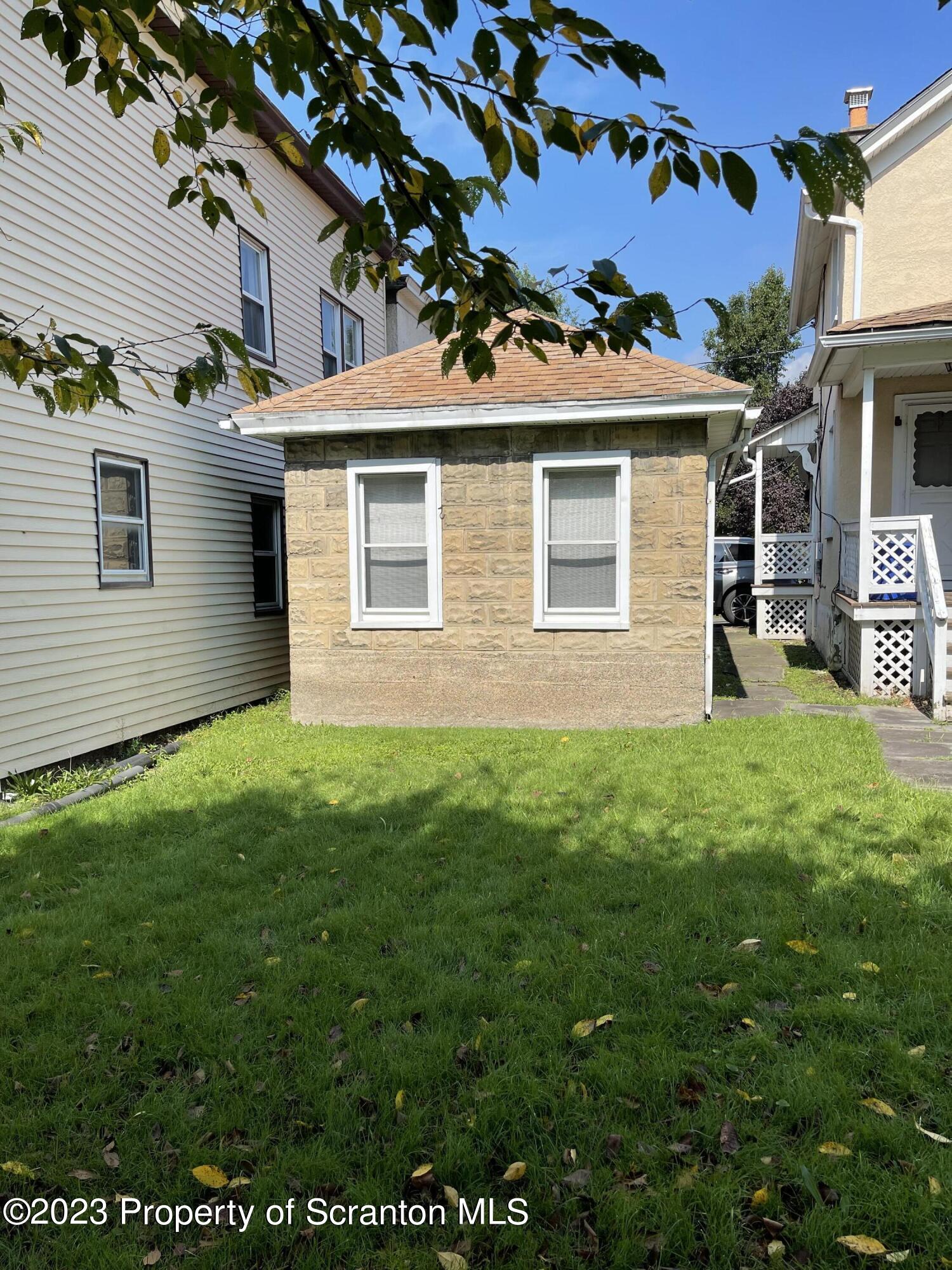 302 Rear Delaware Street Archbald, PA 18403 - Photo 20 of 20 a front view of a house with a yard