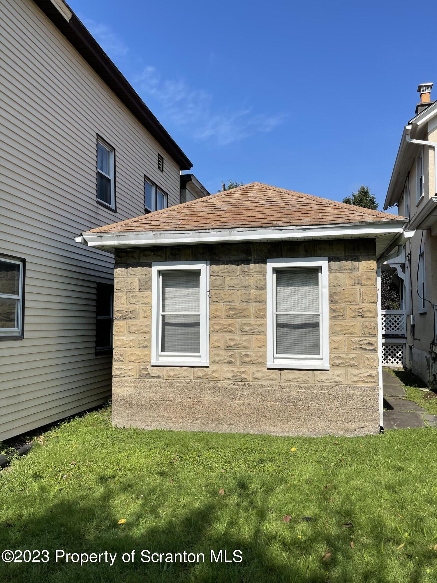302 Rear Delaware Street Archbald, PA 18403 - Photo 2 of 20 a front view of a house with a yard