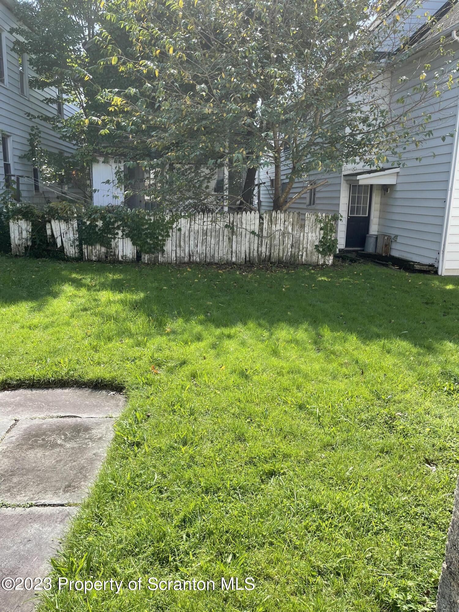 302 Rear Delaware Street Archbald, PA 18403 - Photo 3 of 20 a view of a house with backyard and a tree
