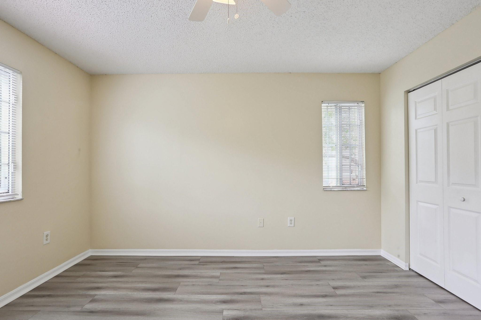 5051 Wiles Road, Unit 201 Coconut Creek, FL 33073 - Photo 28 of 41 wooden floor in an empty room