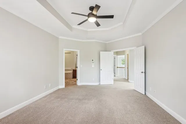 a view of empty room with ceiling fan