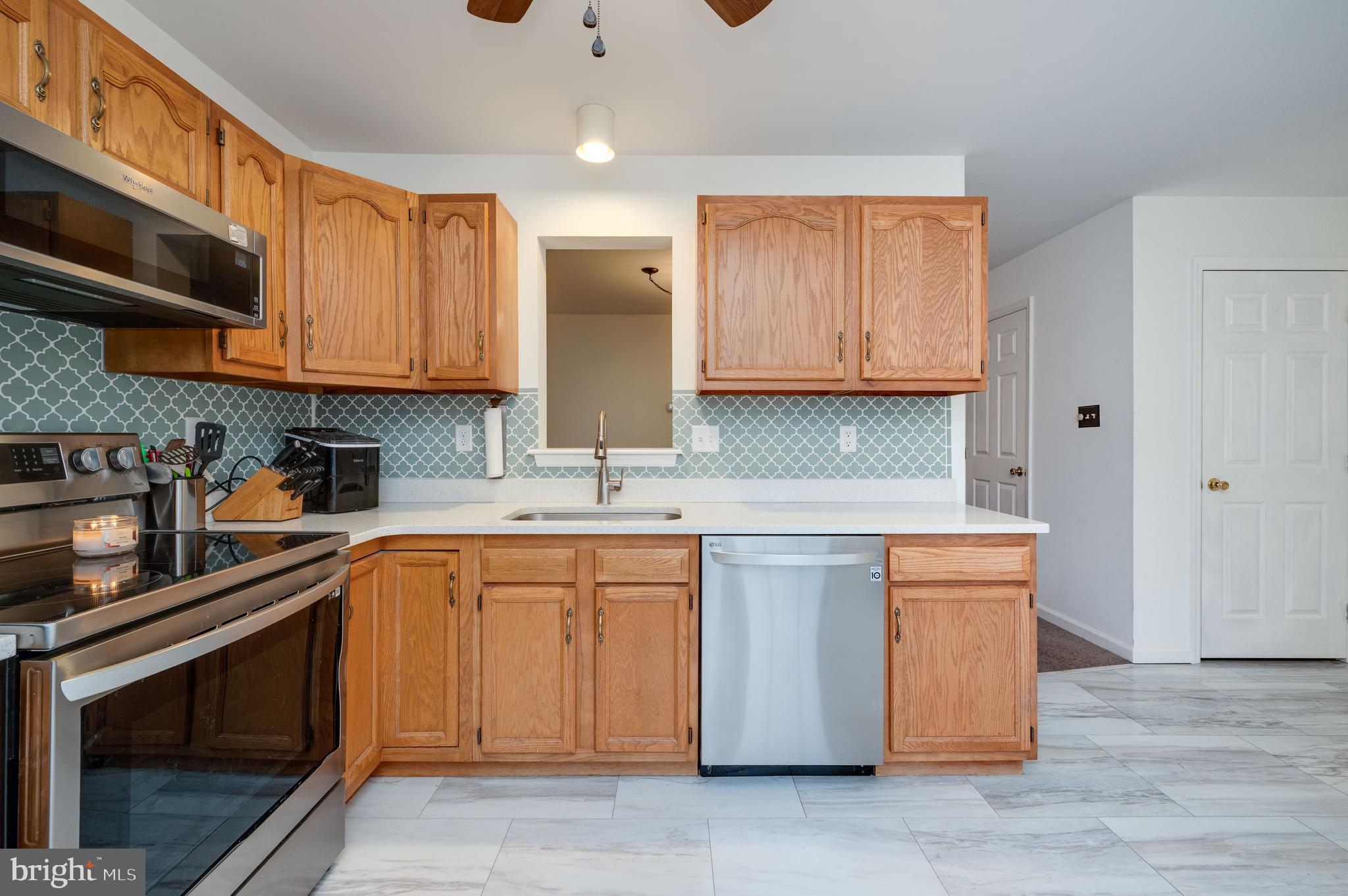 21-4 Cranberry Ridge, Unit 4 Reading, PA 19606 - Photo 11 of 41 a kitchen with stainless steel appliances granite countertop a sink and cabinets