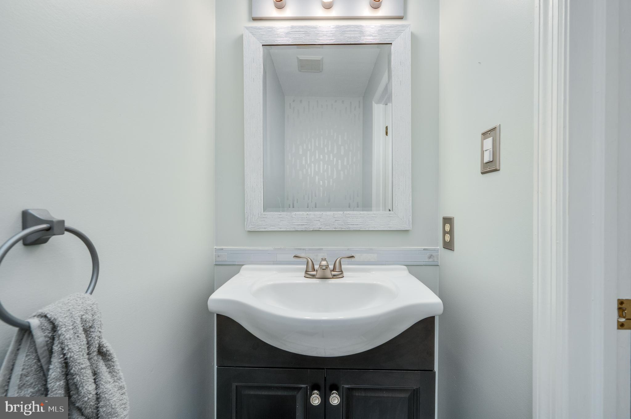 21-4 Cranberry Ridge, Unit 4 Reading, PA 19606 - Photo 14 of 41 a bathroom with a sink and a mirror
