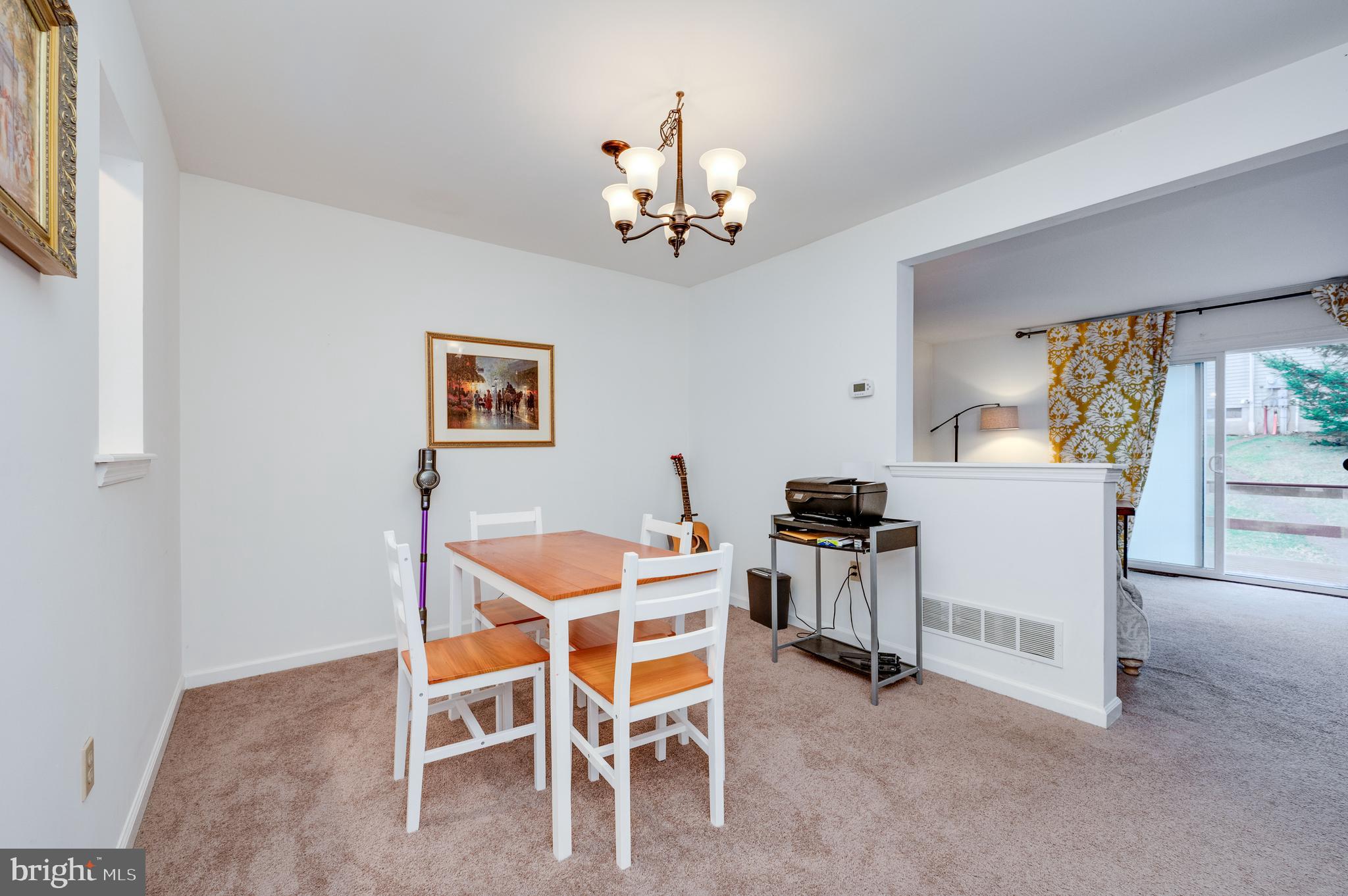 21-4 Cranberry Ridge, Unit 4 Reading, PA 19606 - Photo 15 of 41 a dining room with wooden floor a chandelier a wooden table and chairs