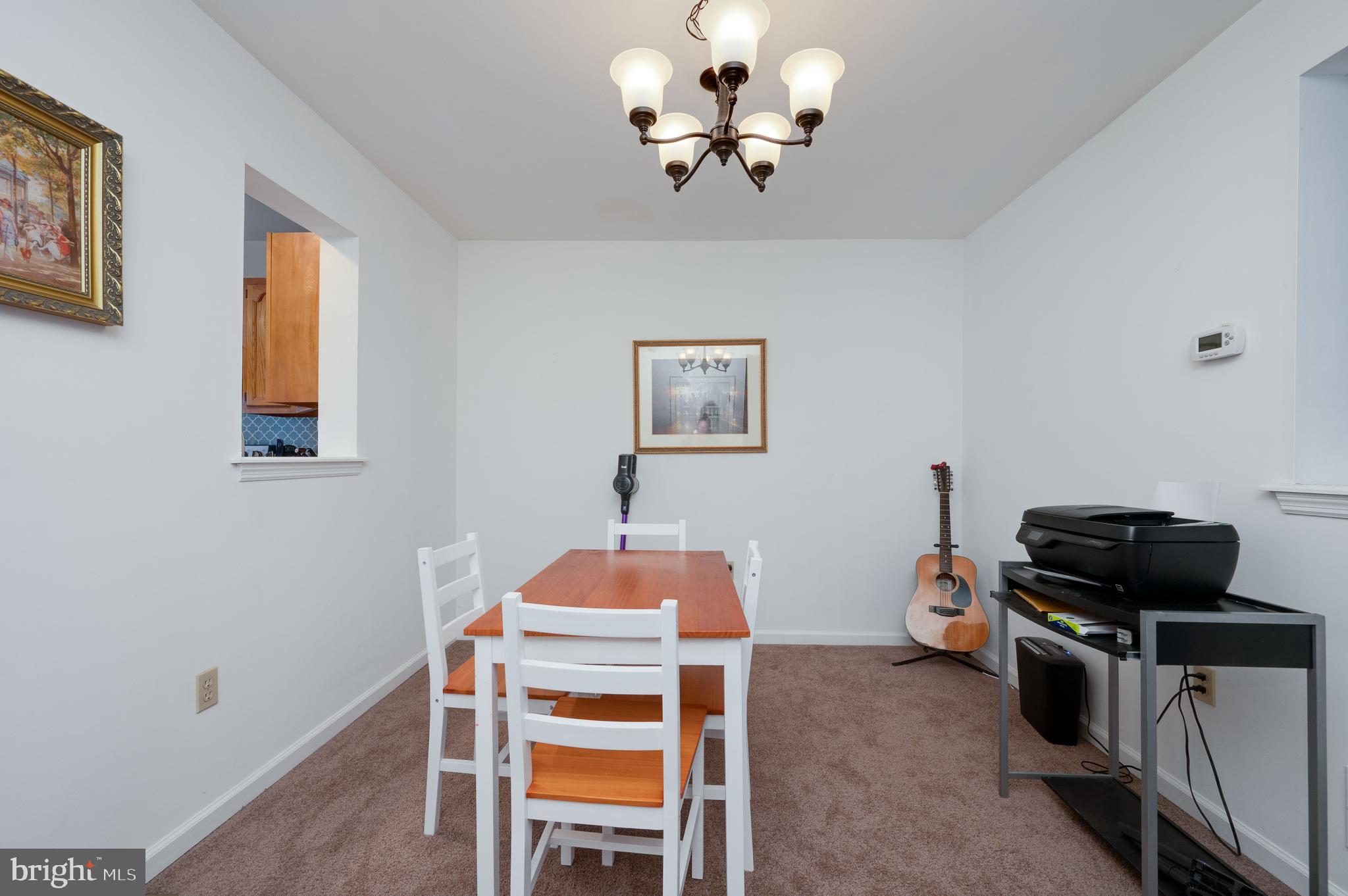 21-4 Cranberry Ridge, Unit 4 Reading, PA 19606 - Photo 16 of 41 a bedroom with a bed and a chandelier