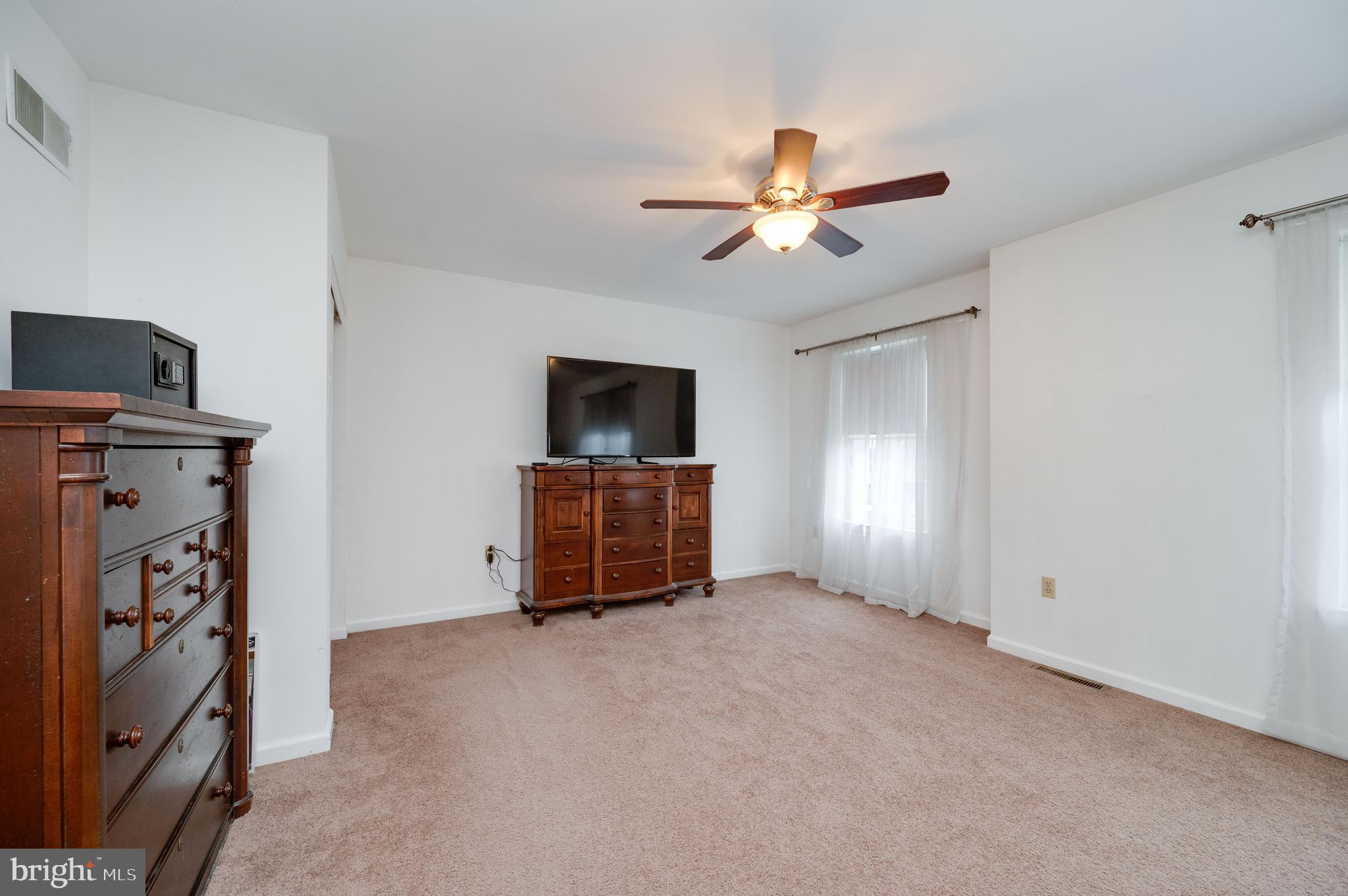 21-4 Cranberry Ridge, Unit 4 Reading, PA 19606 - Photo 24 of 41 a living room with furniture and a flat screen tv