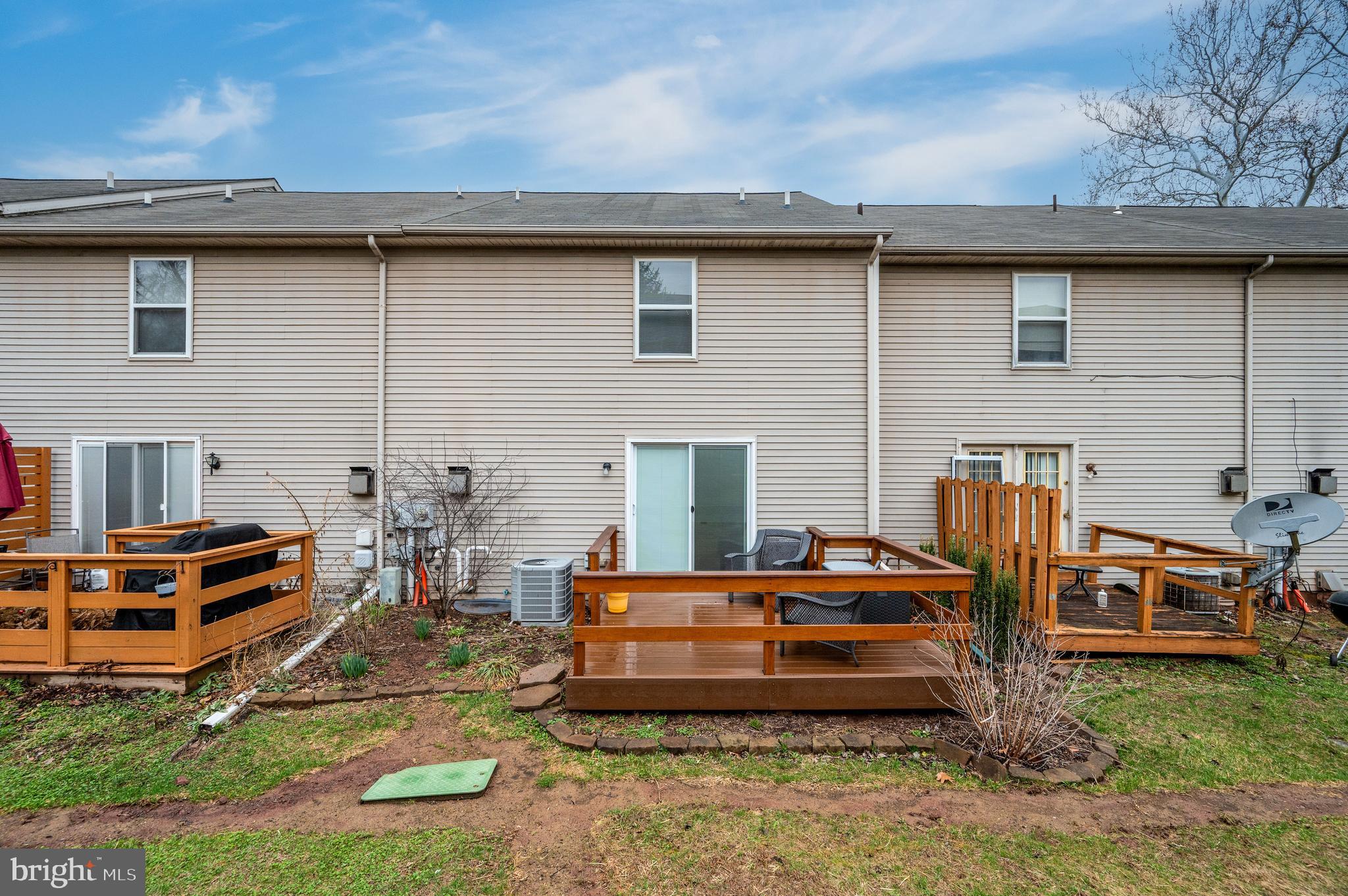 21-4 Cranberry Ridge, Unit 4 Reading, PA 19606 - Photo 39 of 41 a backyard of a house with barbeque oven table and chairs