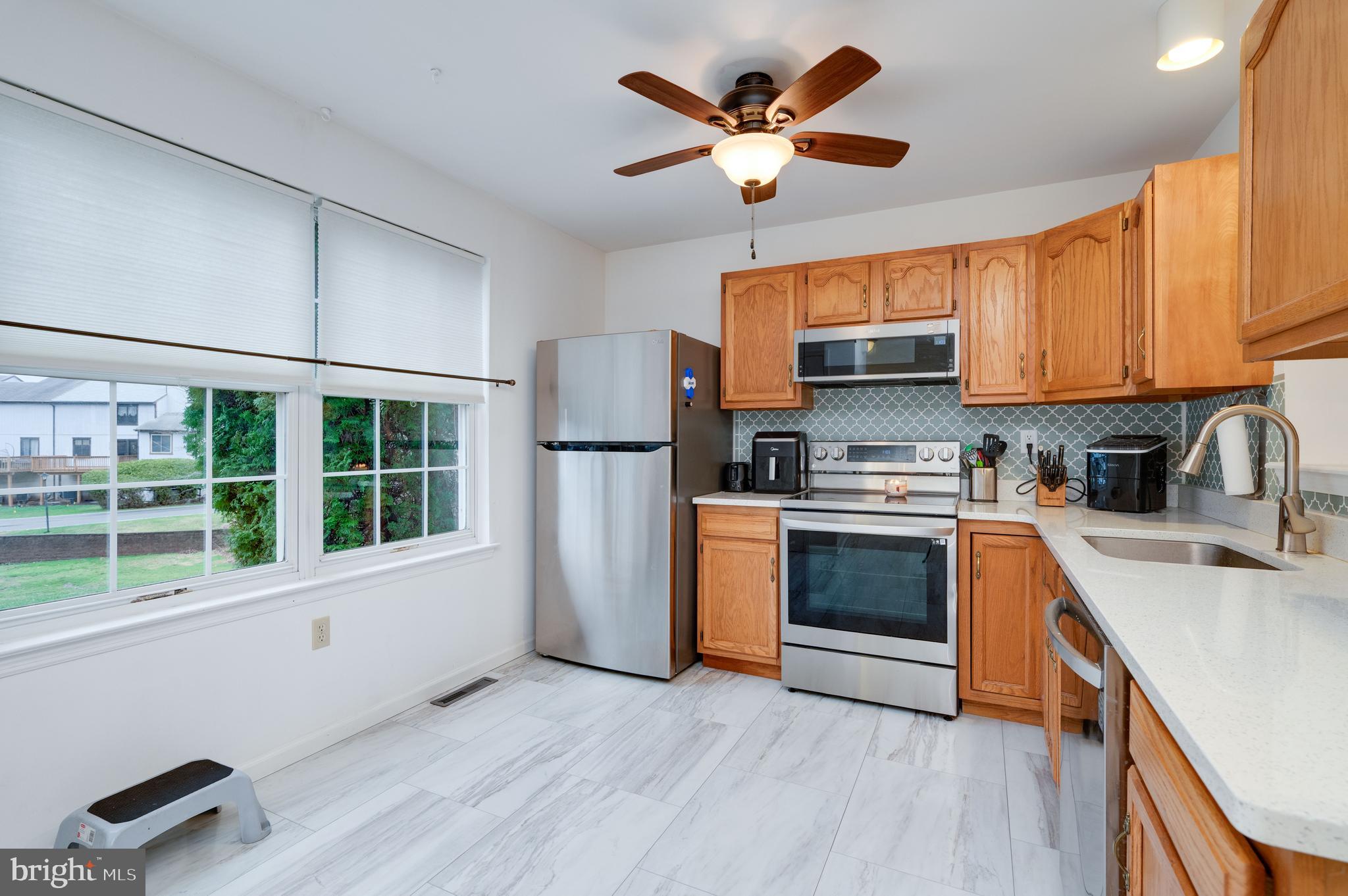 21-4 Cranberry Ridge, Unit 4 Reading, PA 19606 - Photo 8 of 41 a kitchen with stainless steel appliances granite countertop a stove a sink and a refrigerator