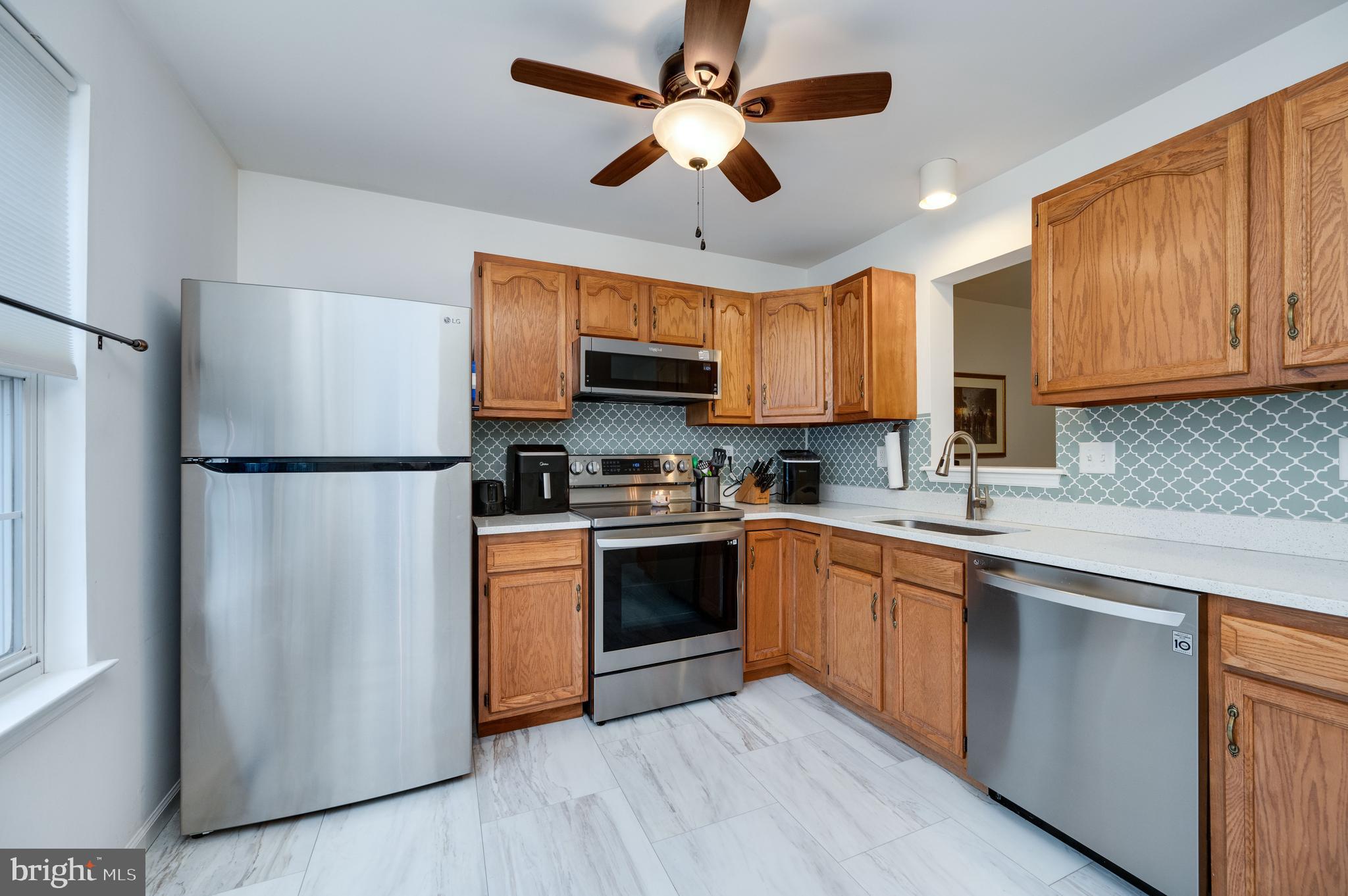 21-4 Cranberry Ridge, Unit 4 Reading, PA 19606 - Photo 9 of 41 a kitchen with stainless steel appliances granite countertop a refrigerator a sink dishwasher a stove and a refrigerator