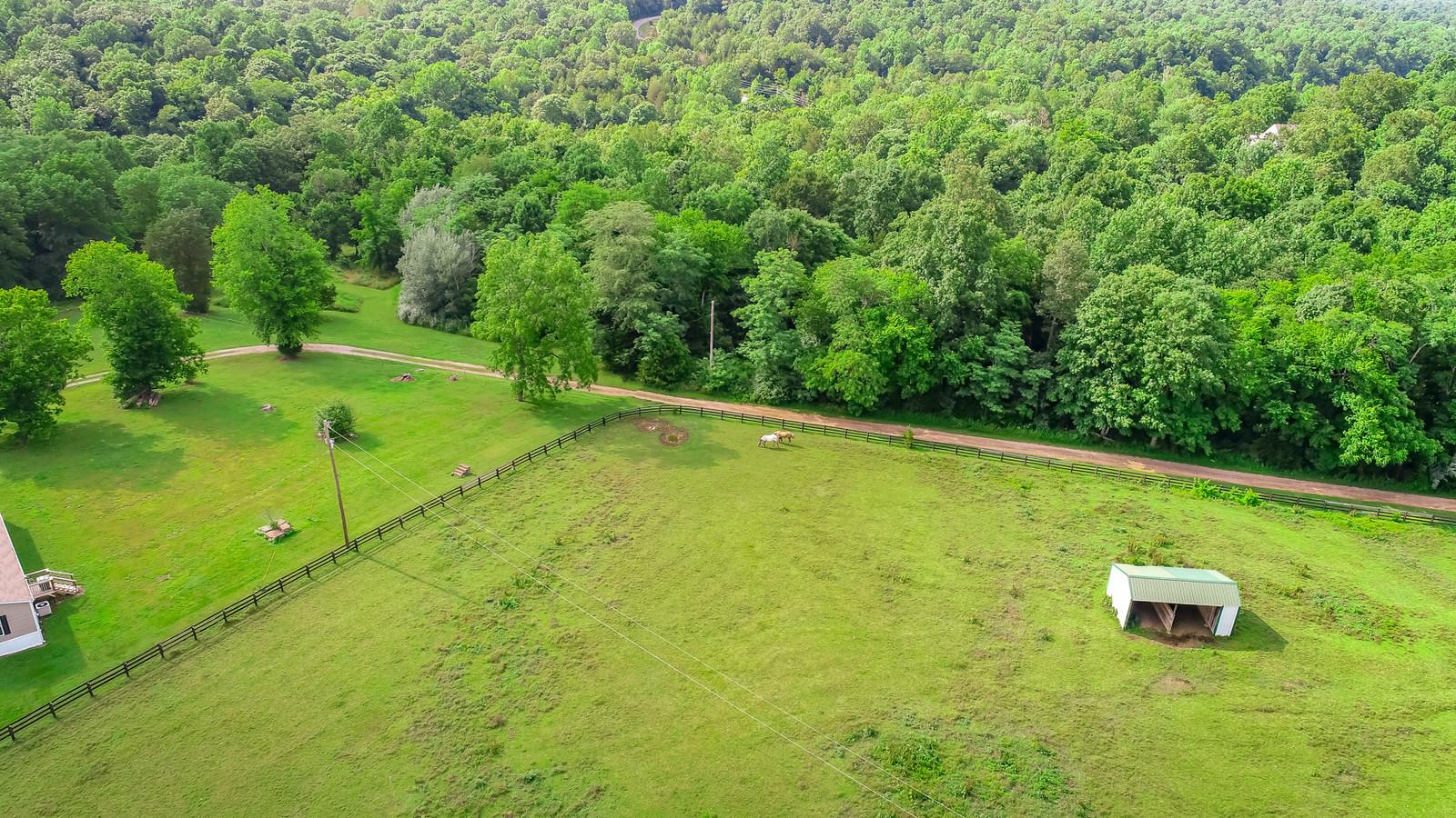 3801 Lake Road Woodlawn, TN 37191 - Photo 1 of 23 Gorgeous Country Side Perfect For Horse Back Riding, Fishing, & Hunting!
