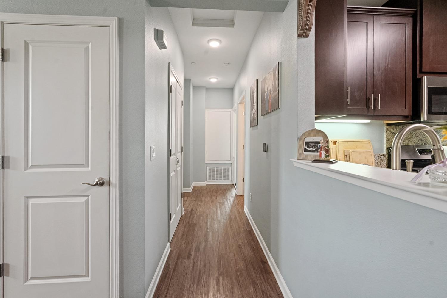 140 Ivy Avenue, Unit A5 Patterson, CA 95363 - Photo 18 of 26 a view of a hallway with wooden floor