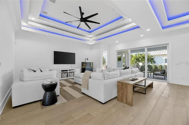 a bedroom with a bed tv and a window