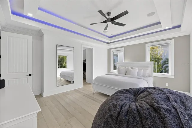 a spacious bedroom with a bed and a table