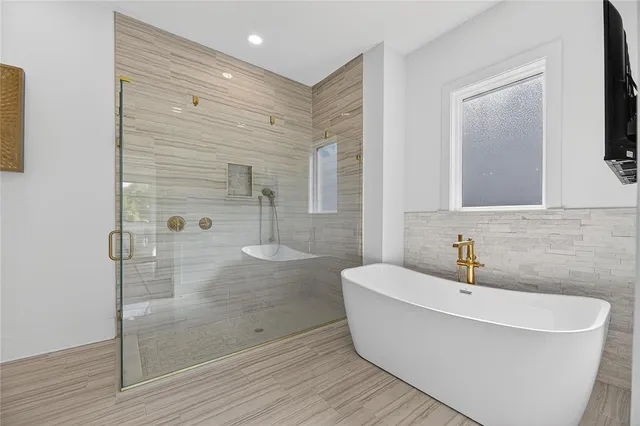 a living room with furniture a table and a large window