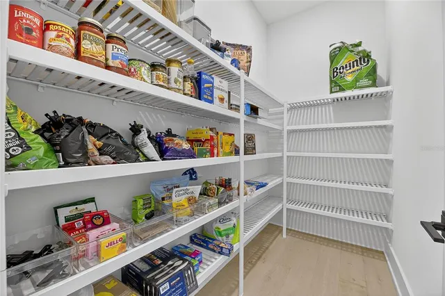 an aerial view of a house with a lake