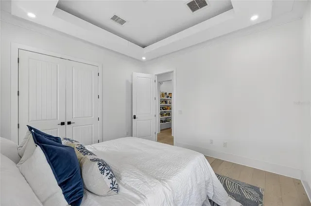 an aerial view of a house with a yard and outdoor seating