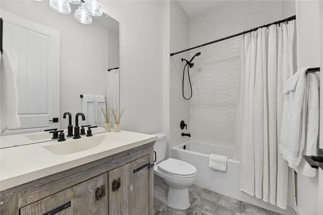 an aerial view of a residential houses with outdoor space