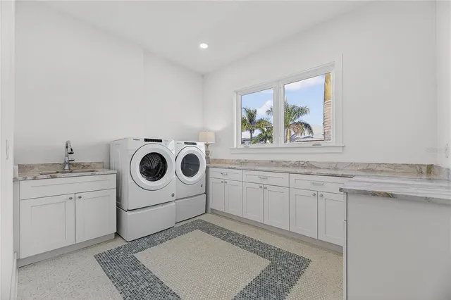 an aerial view of a residential houses with outdoor space