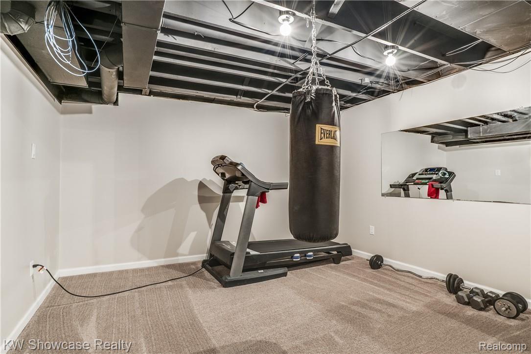 1422 North Hacker Road Howell, MI 48843 - Photo 39 of 44 There is a great workout room in the lower level too.